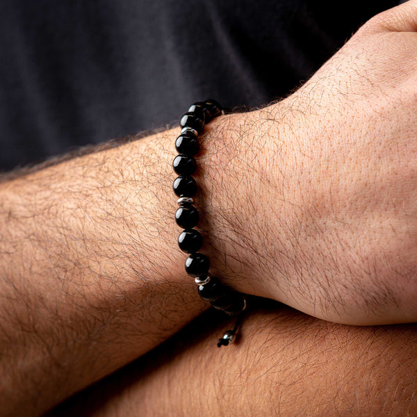 Black Onyx Beads Bracelet with Silver Marenca Logo, model arm
