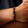 Black Onyx Beads Bracelet with Gold Marenca Logo on model close up